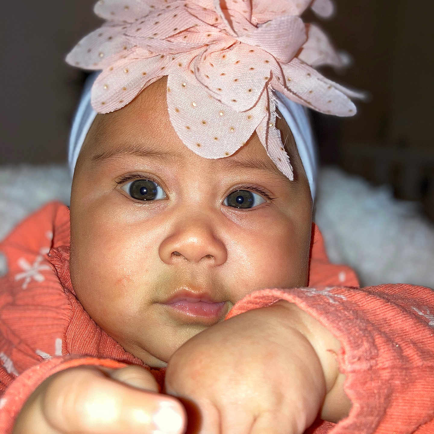 Kiana is registered to the contest to win money with this photo: accessories, applique, baby, bodypart, bonnet, cap, clothing, face, finger, hand, happy, hat, head, headband, newborn, person, photography, portrait, smile, wrist