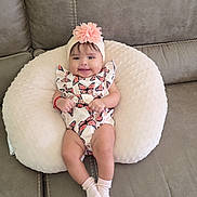 Elaine is registered to the contest to win money with this photo: baby, infant, smile, headband, flower, butterfly, cushion, sofa, socks, cute, happy, child, indoor, portrait, clothing, seat, relaxing, person, home, comfort
