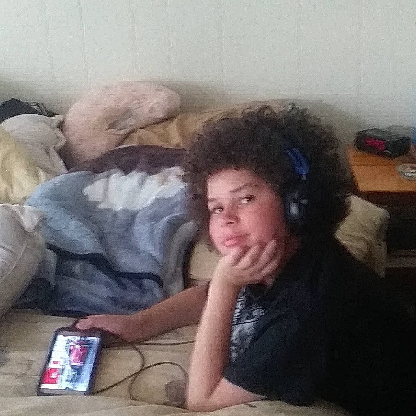 Deandre Mack is registered to the contest to win money with this photo: child, communication_device, electronic_device, fun, gadget, mobile_phone, person, portable_communications_device, selfie, technology