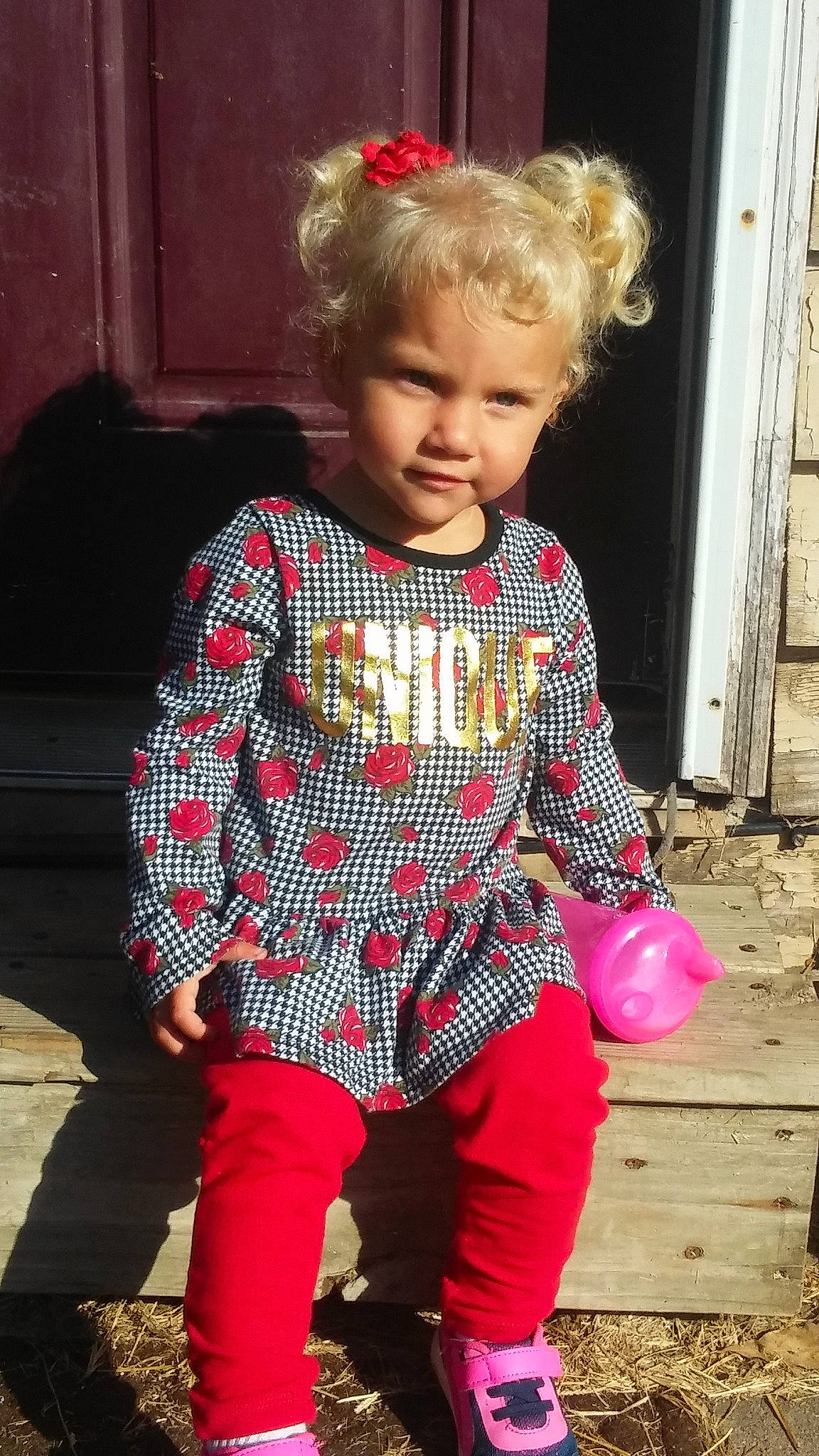 Jaxie is registered to the contest to win money with this photo: blond, child, child_model, design, pattern, person, pink, plaid, play, red, shoe, sitting, sleeve, standing, tartan, textile, toddler