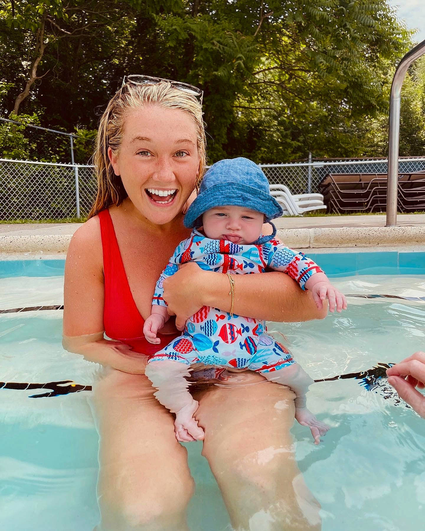 Richie is registered to the contest to win money with this photo: aqua, brassiere, event, fun, happy, hat, head, headgear, headwear, joy, leisure, person, personal_protective_equipment, recreation, smile, summer, swimming_pool, swimwear, thigh, toddler