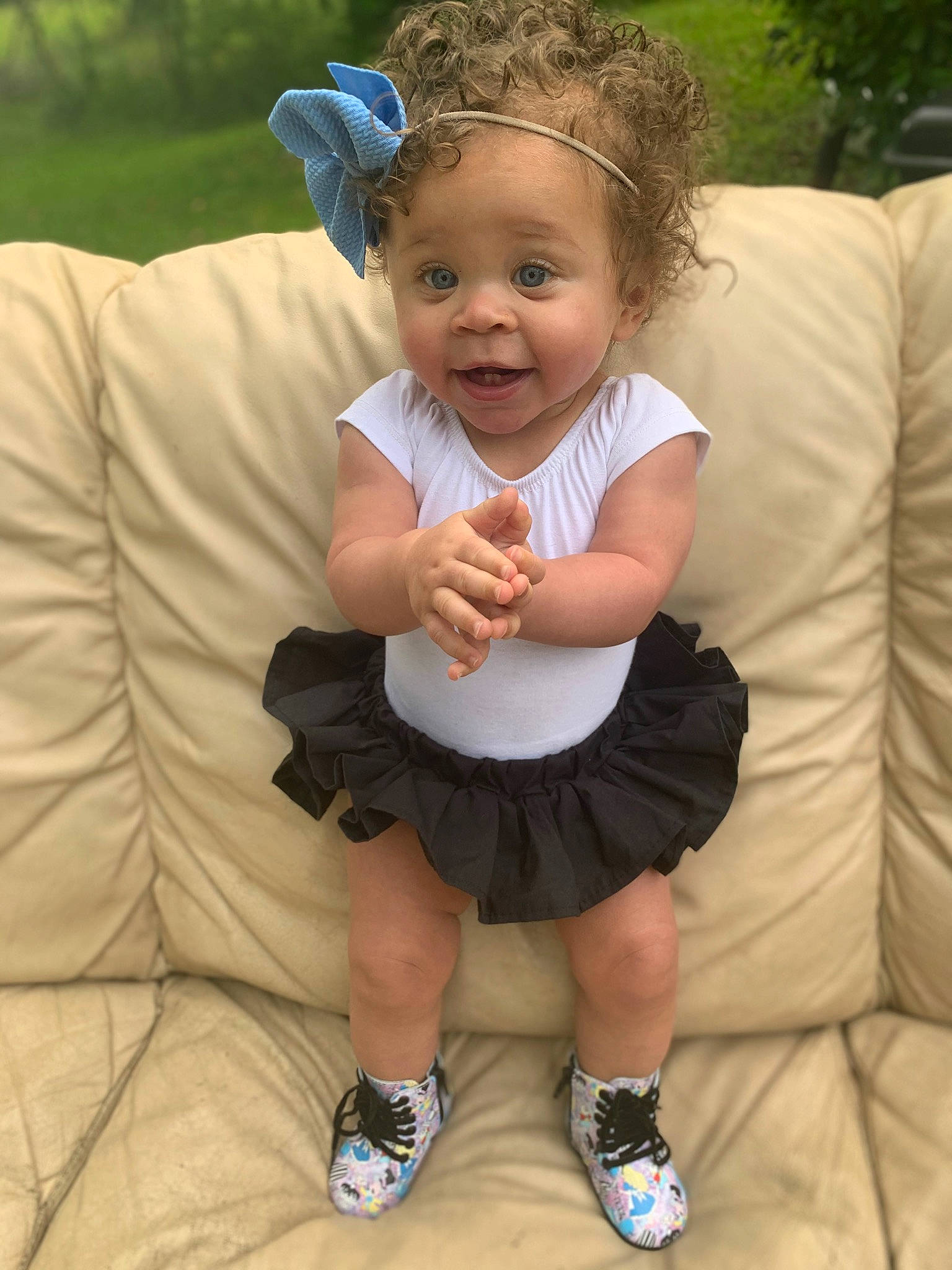 Amaria is registered to the contest to win money with this photo: baby_toddler_clothing, dress, face, finger, fun, gesture, grass, hair, hairstyle, happy, head, headpiece, people_in_nature, person, pink, shorts, skin, smile, summer, toddler