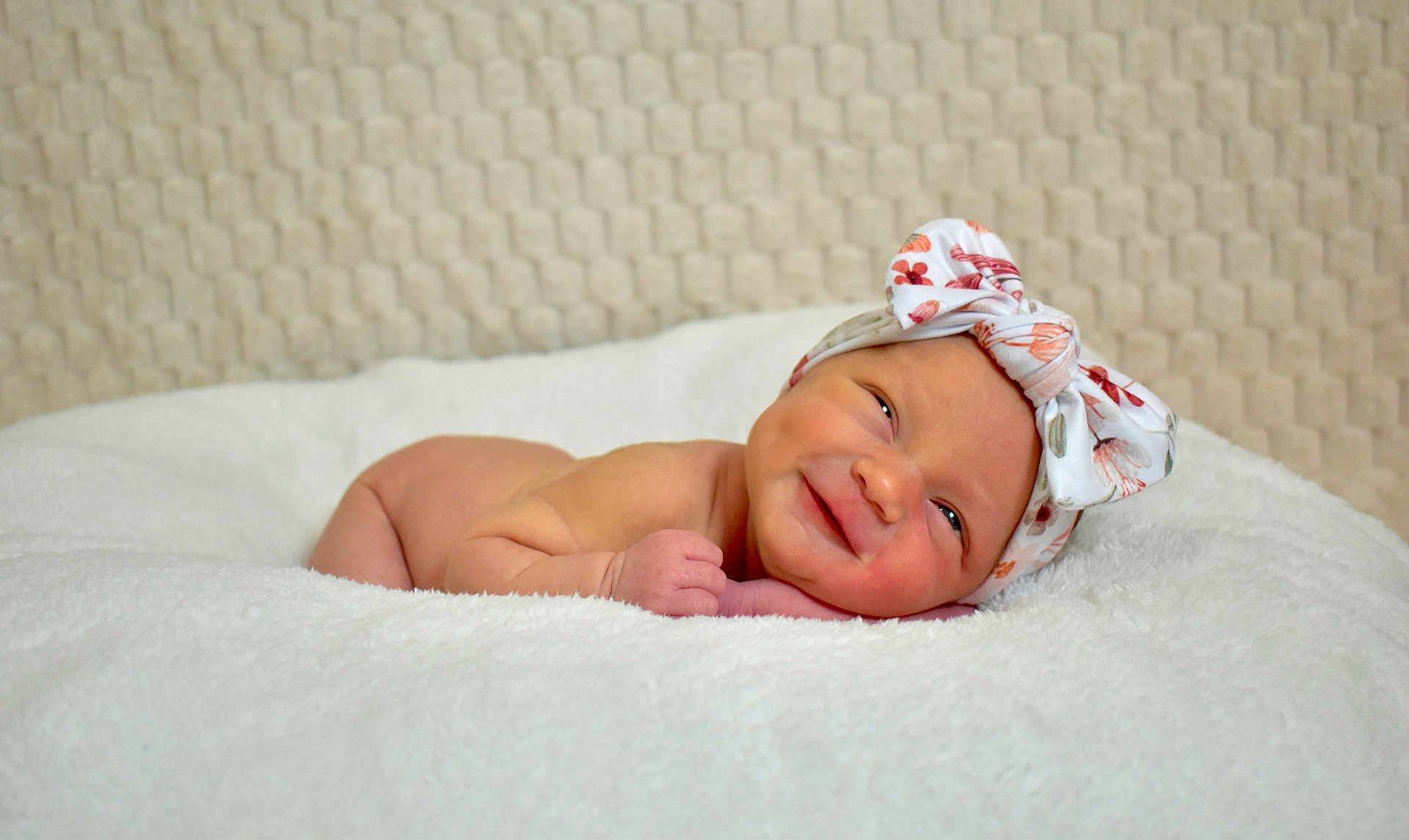 Oaklynn joined the competition — help win amazing prizes! baby, newborn, infant, smiling, headband, bow, blanket, white, soft, cozy, cute, lying_down, face, skin, child, portrait, indoors, happy, peaceful, fabric