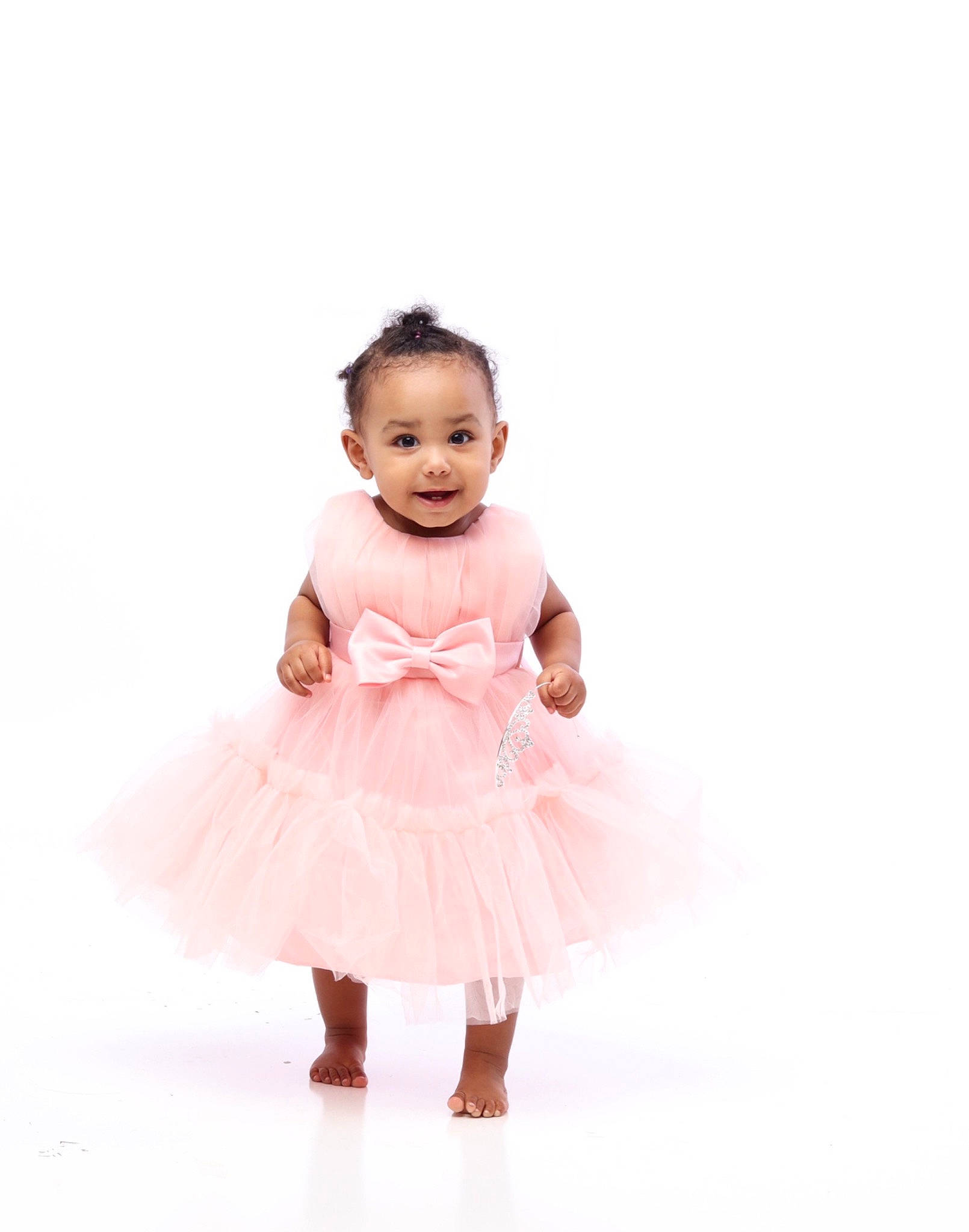 Brooklyn is registered to the contest to win money with this photo: arm, baby, baby_toddler_clothing, dance, day_dress, dress, face, fashion_accessory, fashion_design, gesture, happy, headgear, joy, magenta, one_piece_garment, pattern, person, ruffle, shoulder, sleeve