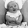 baby, baby_seat, black_and_white, blanket, clothing, comfort, cozy, cushion, cute, expression, face, hands, happy, head, indoors, infant, newborn, person, portrait, smiling