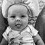 Ivar joined the competition — help win amazing prizes! baby, infant, tongue_out, cute, portrait, black_and_white, soft_texture, cushion, patterned_background, clothing, onesie, smile, face, head_support, happy, child, person, lying_down, closeup, adorable