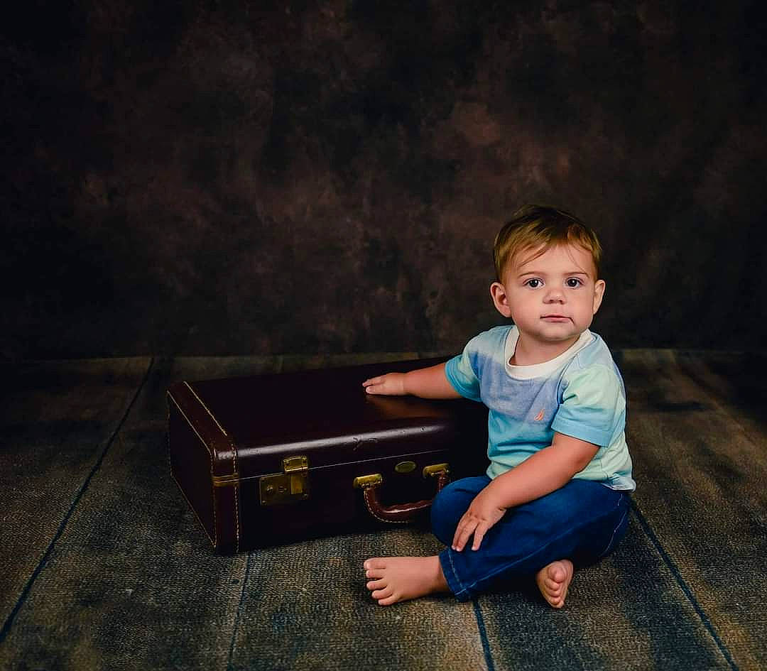 Colton joined the competition — help win amazing prizes! bench, darkness, electric_blue, flash_photography, floor, flooring, fun, grass, happy, human_body, indoor_games_and_sports, leg, leisure, person, recreation, sitting, t_shirt, table, tints_and_shades, toddler