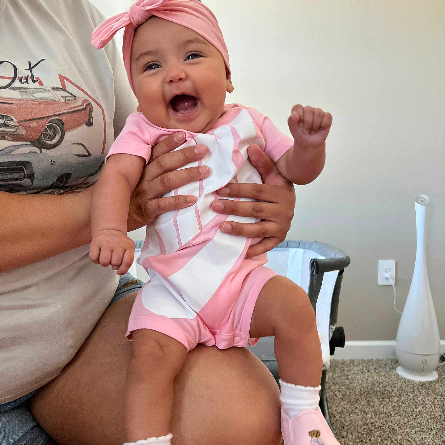 Xyla is registered to the contest to win money with this photo: baby, babylaughing, car, clothing, couch, face, happy, hat, head, machine, pants, people, person, photography, portrait, shorts, sitting, transportation, vehicle, wheel