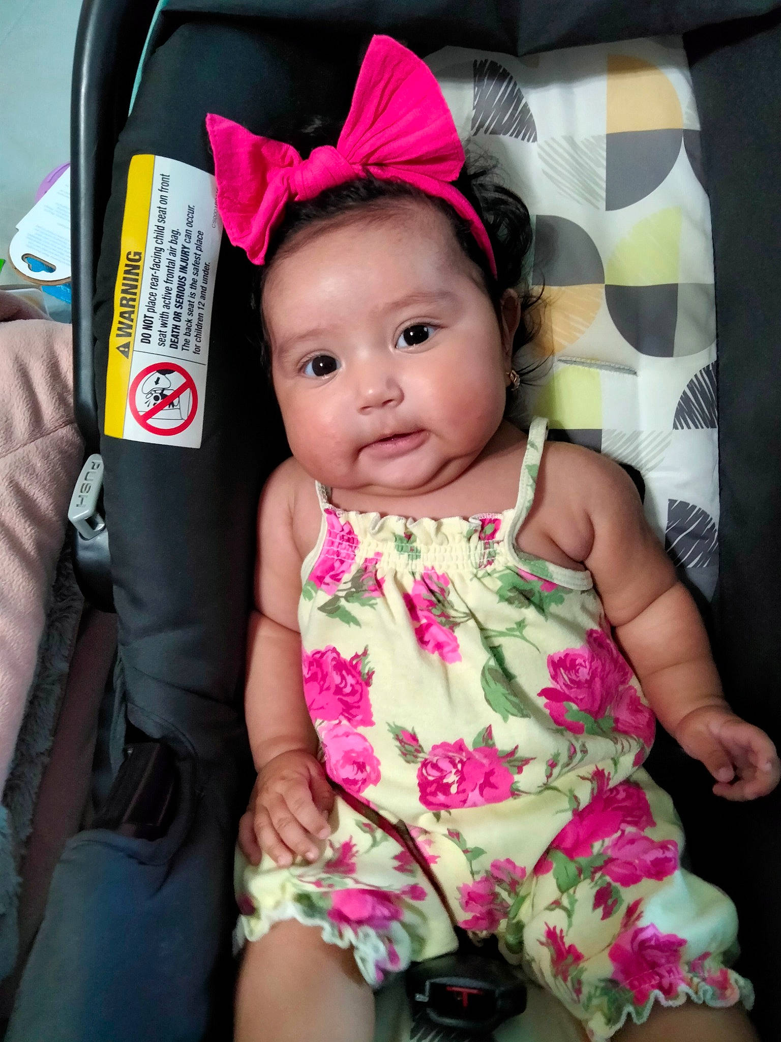 Marisol is registered to the contest to win money with this photo: baby, baby_carriage, baby_toddler_clothing, car_seat, cheek, clothing, eye, eyelash, face, finger, fun, happy, magenta, pattern, person, pink, product, skin, sleeve, thigh