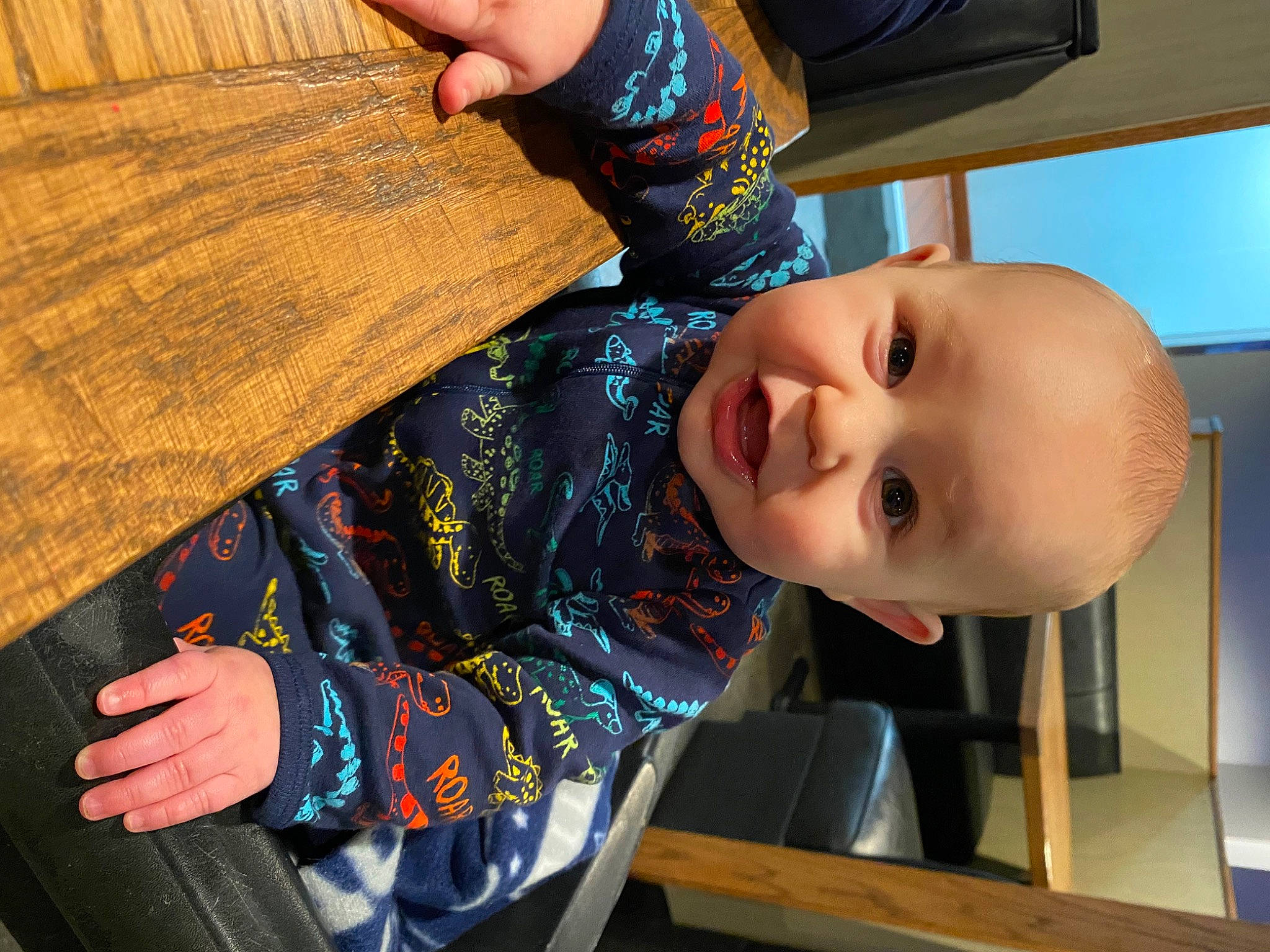 Julian is registered to the contest to win money with this photo: baby, baby_toddler_clothing, child, cool, electric_blue, facial_expression, finger, fun, happy, leisure, nail, nose, pattern, person, play, sleeve, smile, toddler, varnish, wood
