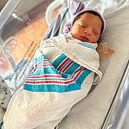 Janiyah is registered to the contest to win money with this photo: architecture, baby, bed, blanket, building, childbirth, crib, face, furniture, head, hospital, infantbed, newborn, person, sleeping
