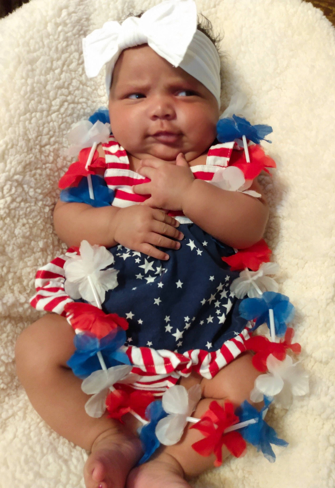 Jessalynn is registered to the contest to win money with this photo: azure, baby, baby_toddler_clothing, blue, cap, eye, face, happy, head, headgear, headwear, human_body, mouth, organ, person, photograph, pink, product, red, skin