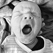Thomas participe au concours pour gagner de l'argent avec cette photo : baby, newborn, yawning, black_and_white, close_up, infant, sleepy, face, mouth_open, blanket, clothing, cozy, portrait, skin, head, expression, cute, small, child, person