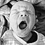 baby, newborn, yawning, black_and_white, close_up, infant, sleepy, face, mouth_open, blanket, clothing, cozy, portrait, skin, head, expression, cute, small, child, person
