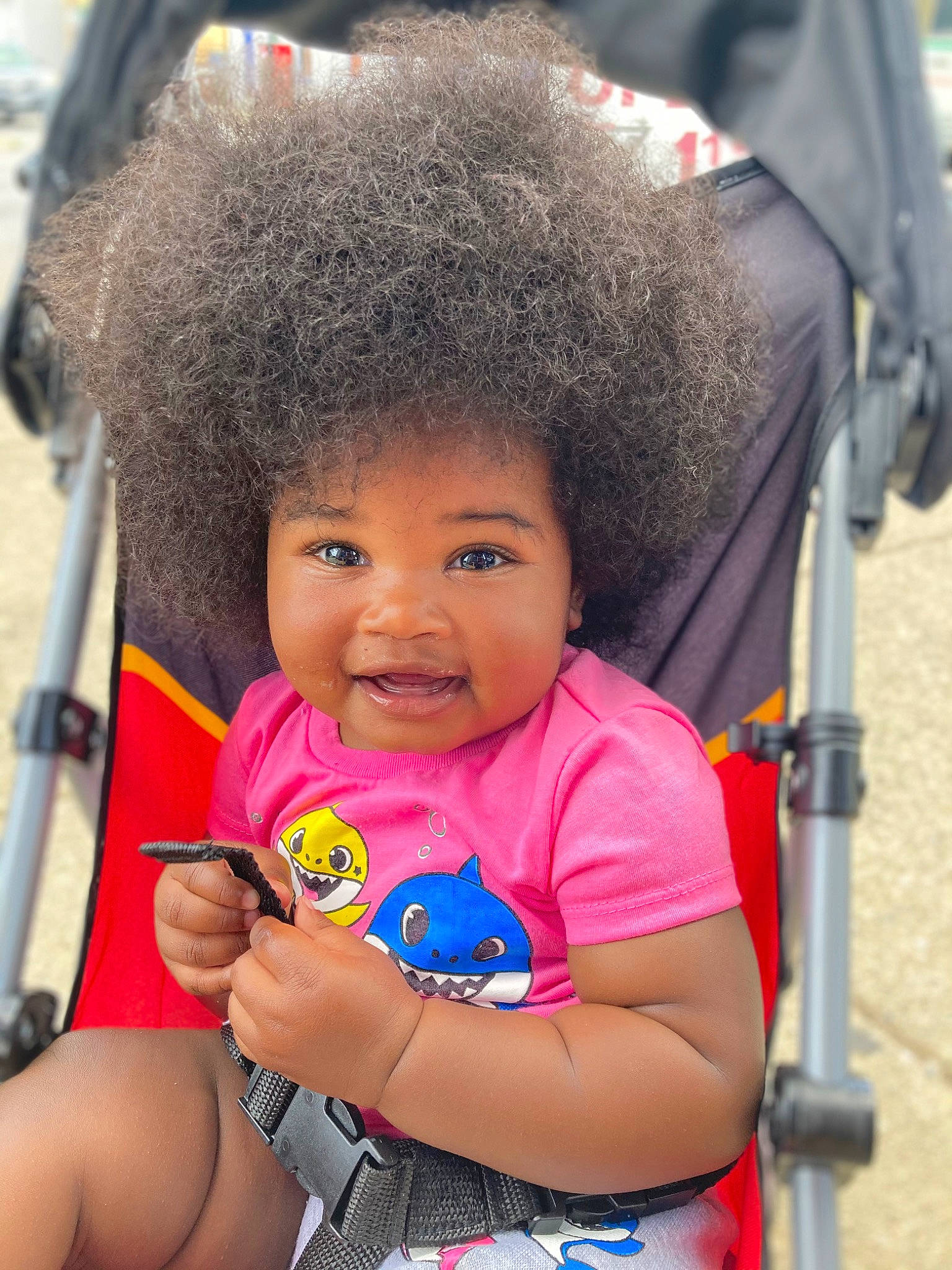 Zariah is registered to the contest to win money with this photo: baby_carriage, baby_products, baby_toddler_clothing, beauty, cheek, child, event, eye, fun, happy, leisure, magenta, person, photograph, product, recreation, sitting, skin, smile, toddler