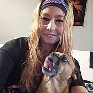 Beau joined the competition — help win amazing prizes! person, woman, dog, pet, selfie, indoor, long_hair, headband, smiling, closeup, tongue_out, small_dog, couch, portrait, living_room, poster, casual_clothing, blond_hair, happy_expression, holding_pet