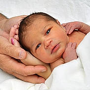 Faith is registered to the contest to win money with this photo: newborn, baby, infant, hands, blanket, skin, portrait, closeup, face, person, family, care, protection, cute, sleepy, small, soft, resting, gentle, love