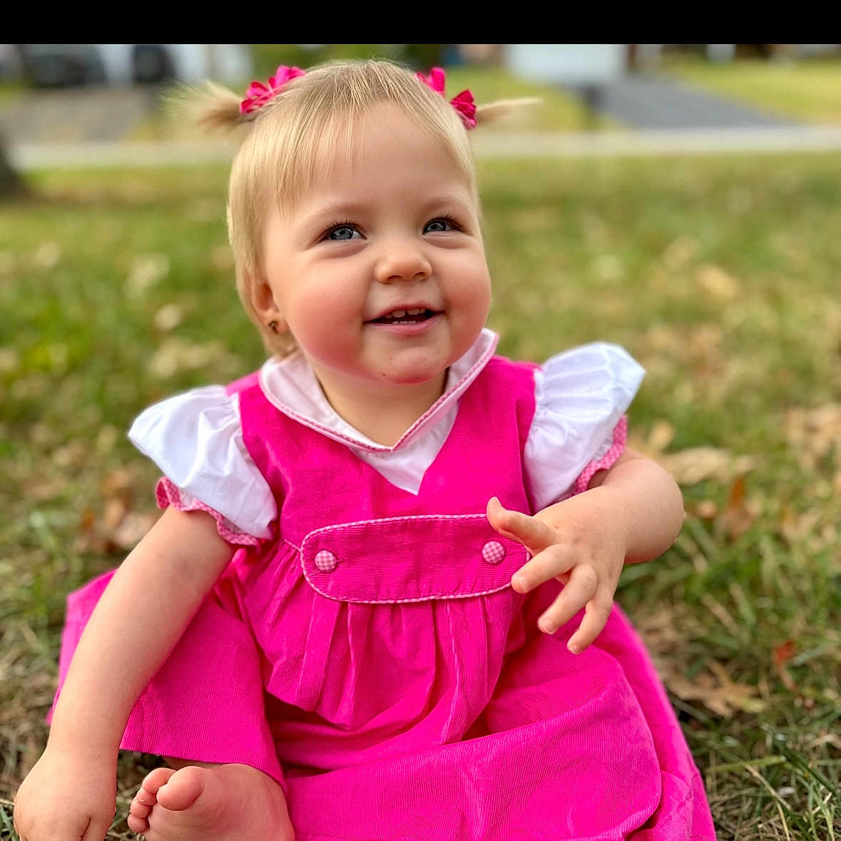 Peyton is registered to the contest to win money with this photo: bodypart, child, clothing, dress, face, female, finger, girl, grass, hand, happy, head, laughing, lawn, pants, person, photography, plant, portrait, smile