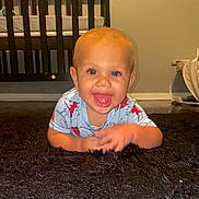 Marquis Junior joined the competition — help win amazing prizes! baby, baby_garment, blue_eyes, child, clothing, crib, cute, floor, furniture, happy, home, indoor, infant, nursery, person, portrait, rug, smiling, toddler, toy