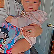 Lilyanna joined the competition — help win amazing prizes! baby, child, person, adult, glasses, tshirt, pink_hoodie, indoor, door, carpet, hand, tattoo, ring, smile, face, arm, leg, foot, wall_art, furniture