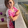 Kenza a rejoint le concours — aidez-le/la à gagner de superbes lots ! balcony, casual_clothing, child, cups, daylight, dish, earrings, expression, footwear, girl, hair, heart_pattern, leaning, outdoor, pink_clothing, portrait, railing, sunlight, table, young