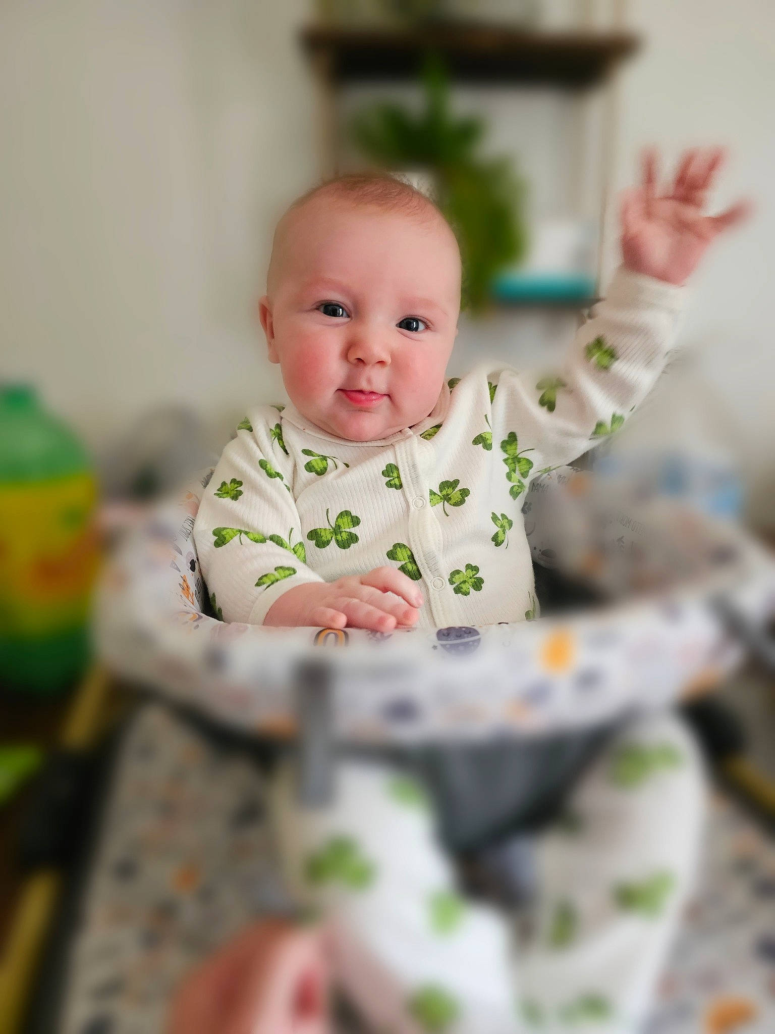 Owen is registered to the contest to win money with this photo: baby, baby_toddler_clothing, bottle, cheek, child, collar, comfort_food, dress, fun, gesture, happy, pattern, person, plant, portrait_photography, sitting, sleeve, smile, t_shirt, toddler