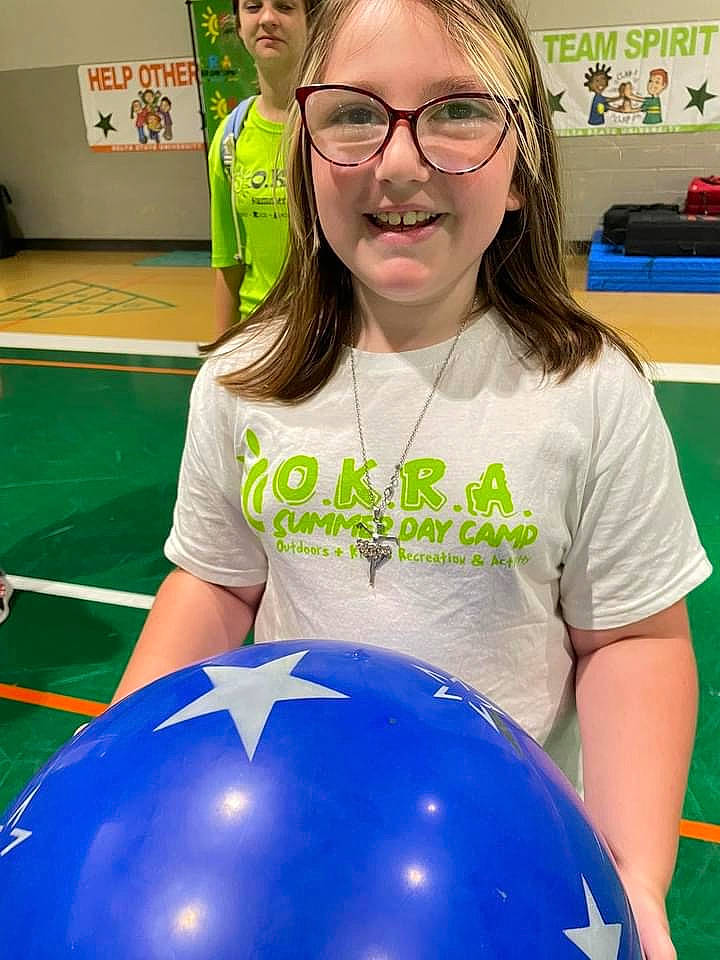 Ashlee joined the competition — help win amazing prizes! balloon, chair, child, electric_blue, event, eyewear, fun, glasses, happy, headwear, joy, leisure, party_supply, person, recreation, room, smile, sphere, t_shirt, thigh