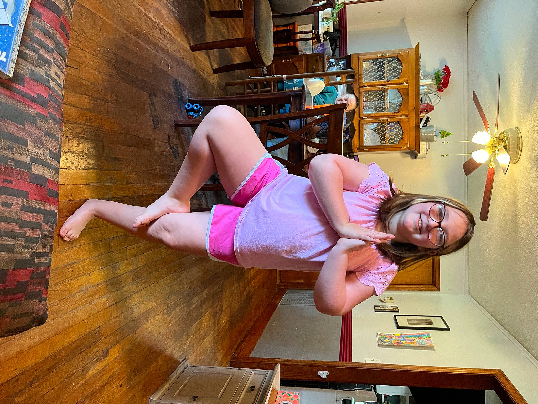 Ashlee joined the competition — help win amazing prizes! abdomen, active_pants, balance, building, chest, comfort, elbow, flooring, hardwood, human_leg, joy, knee, leisure, person, pink, shelf, shorts, sportswear, thigh, trunk