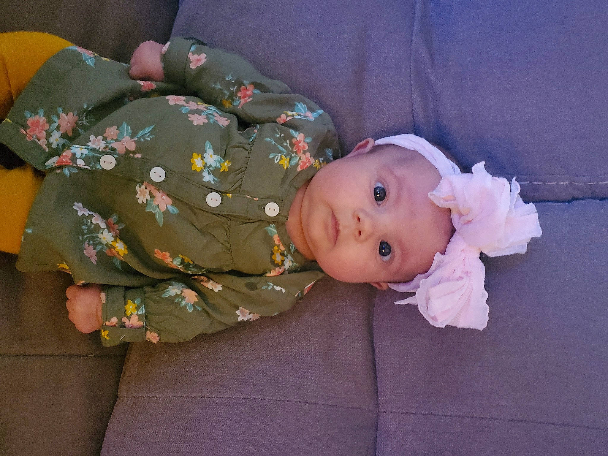 Brynley is registered to the contest to win money with this photo: baby, baby_products, baby_toddler_clothing, baby_toys, child, comfort, headwear, linens, pattern, person, sitting, sleeve, toddler, wood