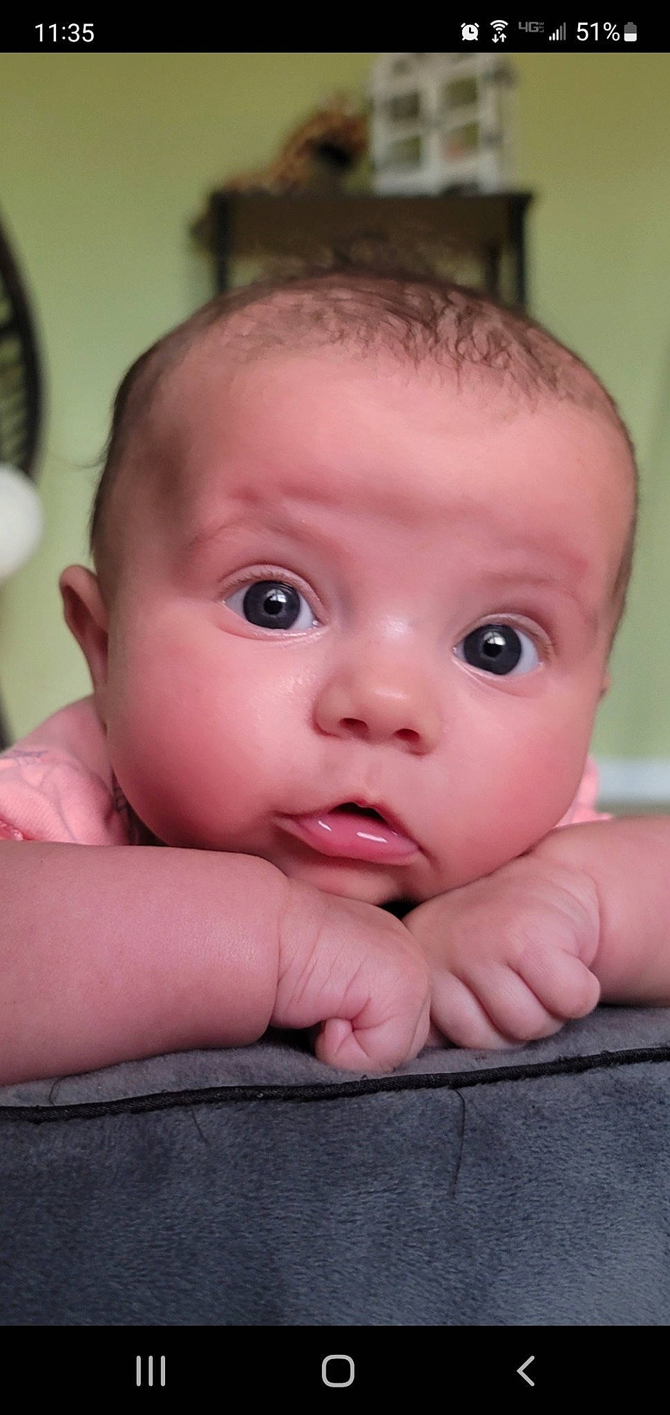 Brynley is registered to the contest to win money with this photo: arm, baby, baby_toddler_clothing, cheek, chin, eye, eyebrow, eyelash, facial_expression, finger, gesture, hand, human_body, iris, lip, mouth, nose, person, skin, thumb