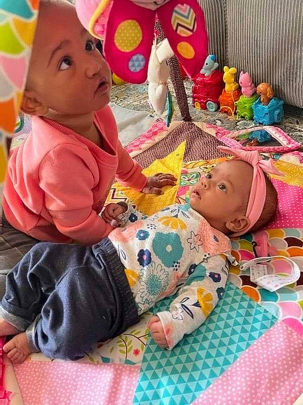 Analla joined the competition — help win amazing prizes! adaptation, art, baby, cheek, child, comfort, doll, event, fun, head, headwear, linens, mammal, pattern, person, pink, room, sitting, surprise, textile
