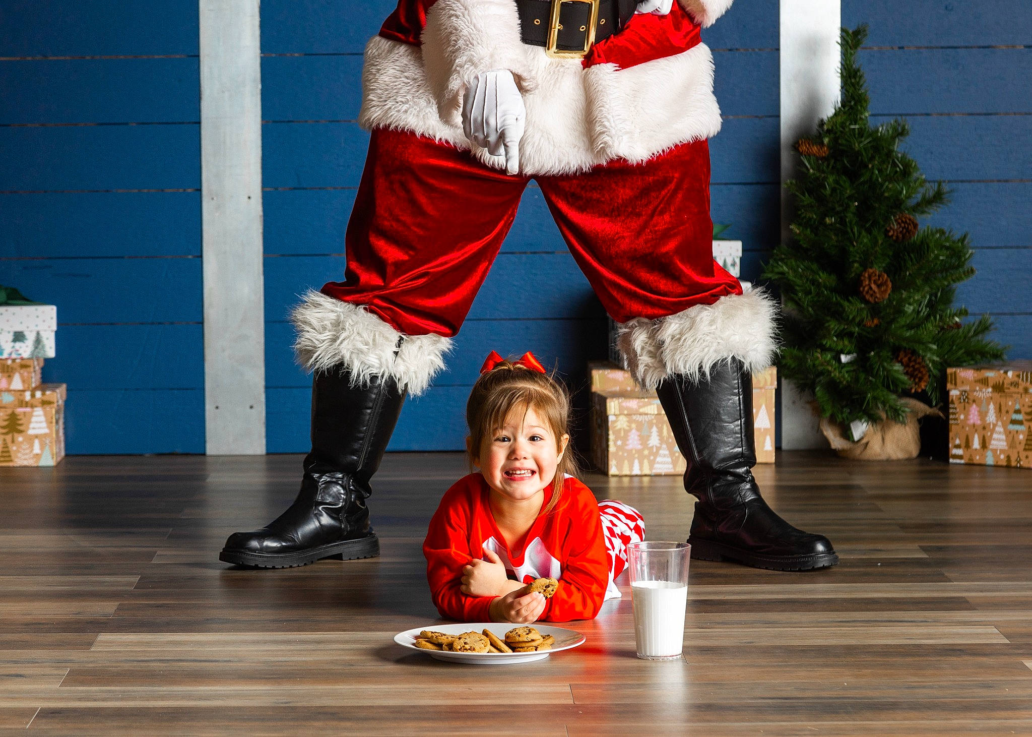 Bailey joined the competition — help win amazing prizes! boot, christmas_decoration, entertainment, event, flooring, footwear, fun, happy, human_leg, joy, leg, leisure, performance_art, performing_arts, person, santa_claus, shoe, sitting, smile, sneakers