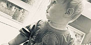 Carson joined the competition — help win amazing prizes! baby, blond_hair, casual_clothing, child, curious, cute, expression, indoors, innocence, monochrome, portrait, shirt, shorts, side_profile, sitting, small_person, soft_light, spiderman, toddler, young_child