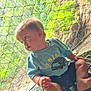 Carson joined the competition — help win amazing prizes! adventure, barefoot, casual_clothing, child, curious, daylight, forest, greenery, metal_grate, nature, netting, outdoor, protective_net, scenic, short_sleeve_shirt, shorts, sitting, toddler, water, waterfall
