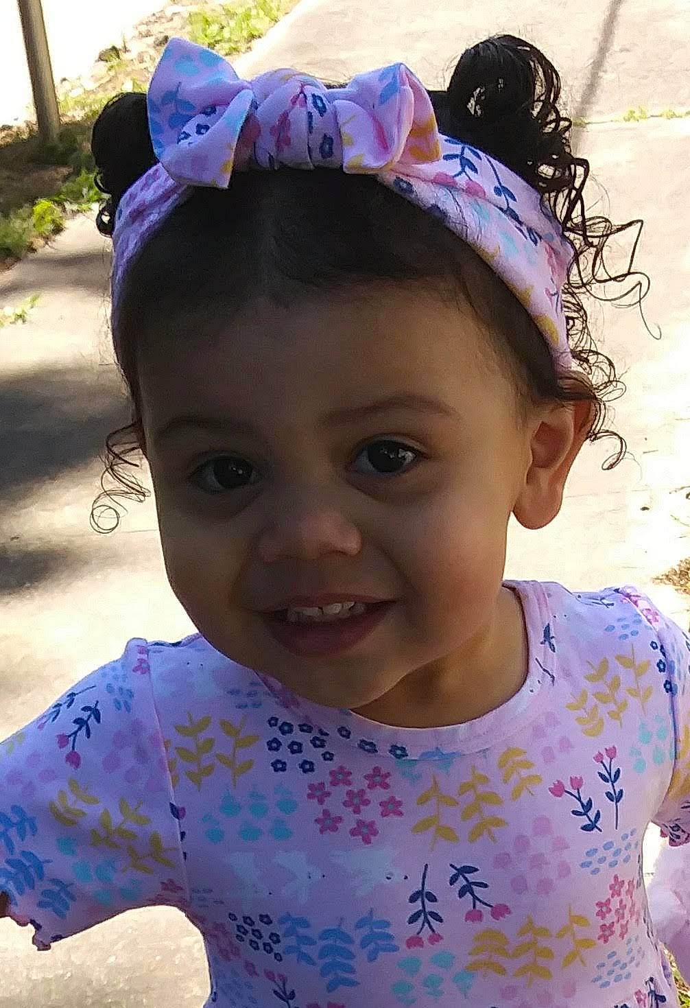 Ivey is registered to the contest to win money with this photo: cheek, child, ear, face, fashion_accessory, forehead, hair_accessory, happy, head, headband, headgear, joy, lavender, neck, person, pink, purple, smile, toddler