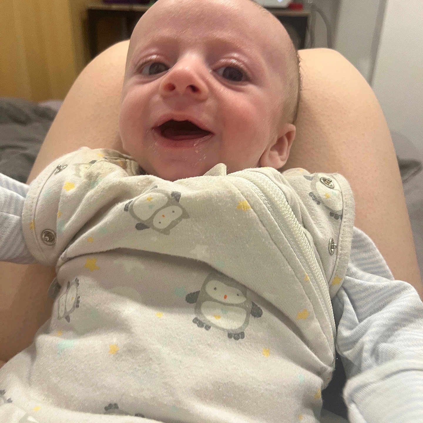 Grayson-Lee joined the competition — help win amazing prizes! baby, bed, blanket, child, closeup, clothing, cute, face, happy, indoor, infant, legs, onesie, penguin_pattern, person, portrait, skin, sleeve, smile, young