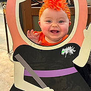 Avalynn joined the competition — help win amazing prizes! baby, child, smiling, halloween, witch, costume, cardboard_cutout, broom, orange, hat, flower, portrait, face, indoors, decorations, craft, celebration, happy, infant, playful