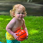 Tj. is registered to the contest to win money with this photo: toddler, child, basketball, grass, outdoor, curly_hair, blonde, water, summer, play, bare_chest, shorts, greenery, toy, fun, cute, young_child, nature, sport, active