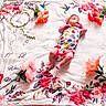 Mackenzie joined the competition — help win amazing prizes! baby, infant, milestone_blanket, flowers, floral_pattern, onesie, headband, colorful_clothing, lying_down, baby_milestone, pink_flowers, decorative_blanket, numbers, months_marker, soft_texture, cute, portrait, indoors, child, young
