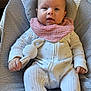 Sofia joined the competition — help win amazing prizes! baby, infant, onesie, pink_bib, knitted_toy, bunny_toy, cushioned_seat, indoor, curious_expression, face, hand, clothing, child, person, seat, comfort, soft_texture, head, eyes, mouth