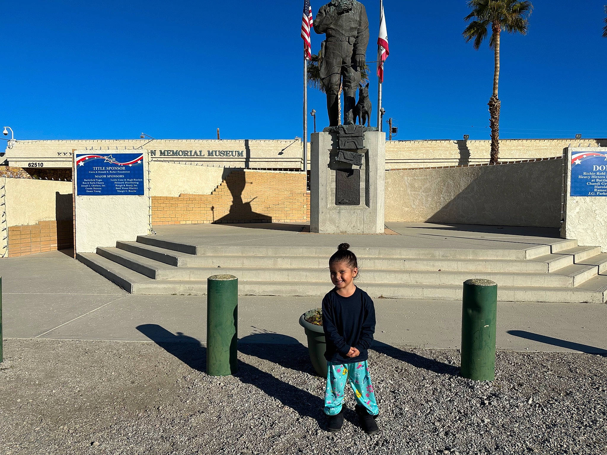 Destiny is registered to the contest to win money with this photo: arecales, bronze_sculpture, city, fun, joy, leisure, monument, national_historic_landmark, palm_tree, pedestrian, person, recreation, sculpture, shadow, sky, statue, toddler, tourism, travel, tree