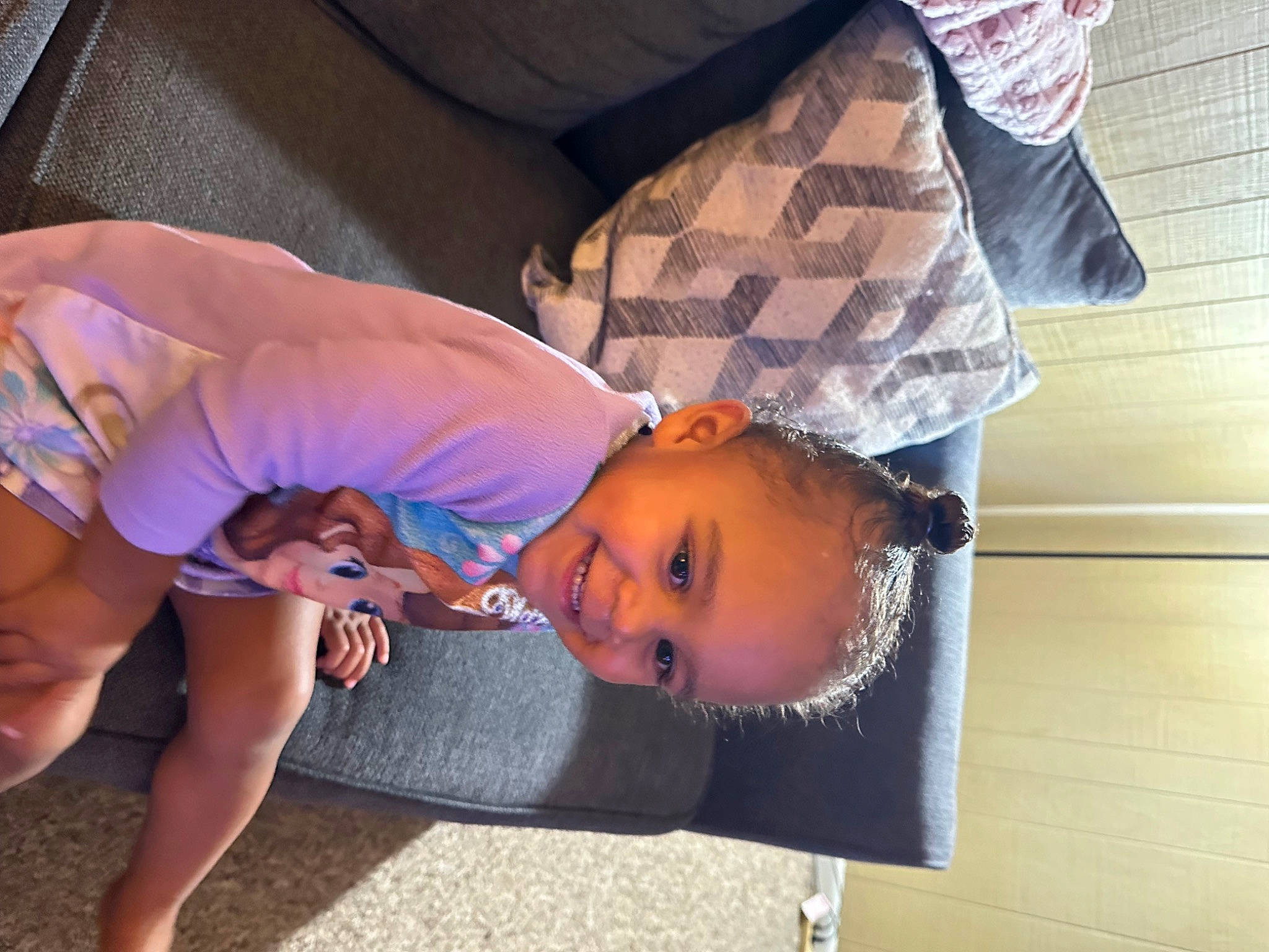 Ava is registered to the contest to win money with this photo: baby, child, comfort, elbow, flooring, fun, grass, happy, human_leg, joy, lap, leisure, mouth, nap, person, play, sitting, sleep, smile, thigh