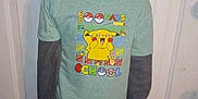 Karsyn joined the competition — help win amazing prizes! child, boy, smiling, standing, shirt, pikachu, clothing, door, indoors, casual, celebration, happy, jeans, person, youth, portrait, hair, hand, feet, floor