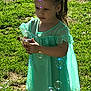 Aleigha is registered to the contest to win money with this photo: child, girl, bubbles, outdoor, sunlight, grass, toy, dinosaur, dress, leggings, pigtails, earrings, playing, nature, summer, greenery, happy, curious, portrait, daytime