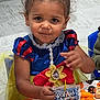 child, girl, costume, snow_white, dress, snack, food, drink, table, party, halloween, pumpkin, plate, cheese_puffs, rice_krispie_treat, indoors, floor, hair_tied, smile, cute