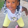child, toddler, portrait, smiling, outdoor, braids, beads, hairstyle, jewelry, earrings, necklace, tank_top, yellow_leggings, pink_shoes, sneakers, fashion, sidewalk, grass, concrete, full_body