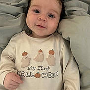Harrison joined the competition — help win amazing prizes! apparel, baby, blanket, celebration, child, clothing, cozy, cute, face, ghost, halloween, holiday, indoors, infant, laying_down, portrait, pumpkin, smile, soft_texture, young_child