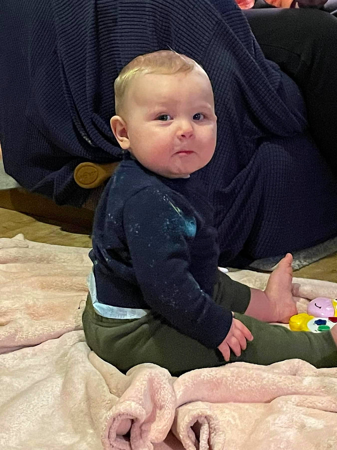 Rowen is registered to the contest to win money with this photo: baby, baby_products, baby_safety, baby_toddler_clothing, chair, cheek, child, comfort, facial_expression, fun, fur, head, lap, linens, person, play, room, sitting, skin, sleeve