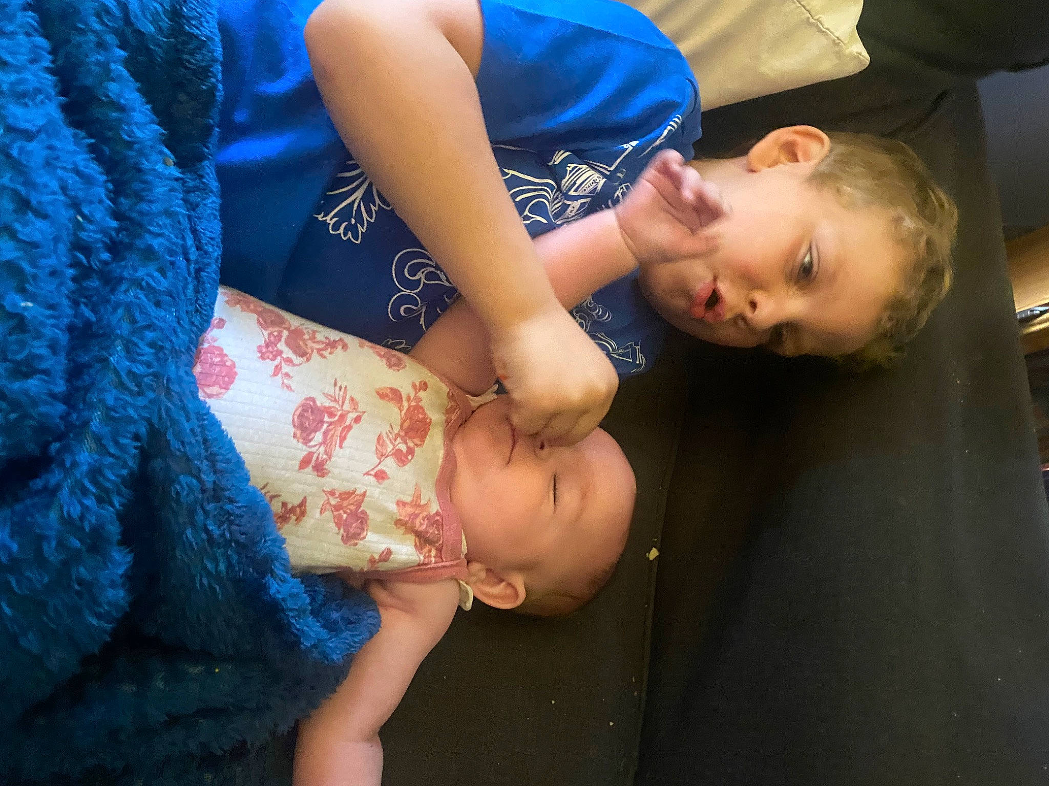 Dustin is registered to the contest to win money with this photo: abdomen, blue, chest, dress, elbow, eye, flash_photography, gesture, glasses, hand, happy, human_leg, jewellery, joint, person, plant, smile, thigh, toddler, tree