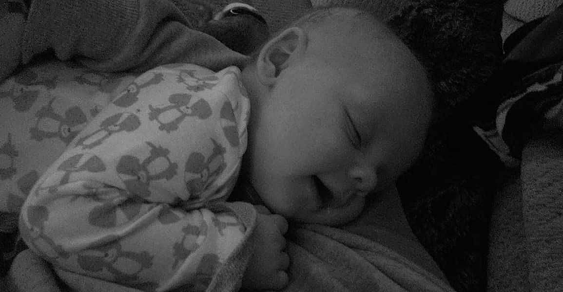 Brighton is registered to the contest to win money with this photo: black, black_and_white, cheek, child, close_up, emotion, eye, face, head, infant, monochrome, monochrome_photography, nap, nose, person, photograph, photography, skin, sleep, snapshot